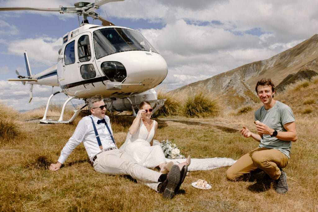 Chopper with bride, groom and photographer in mountains