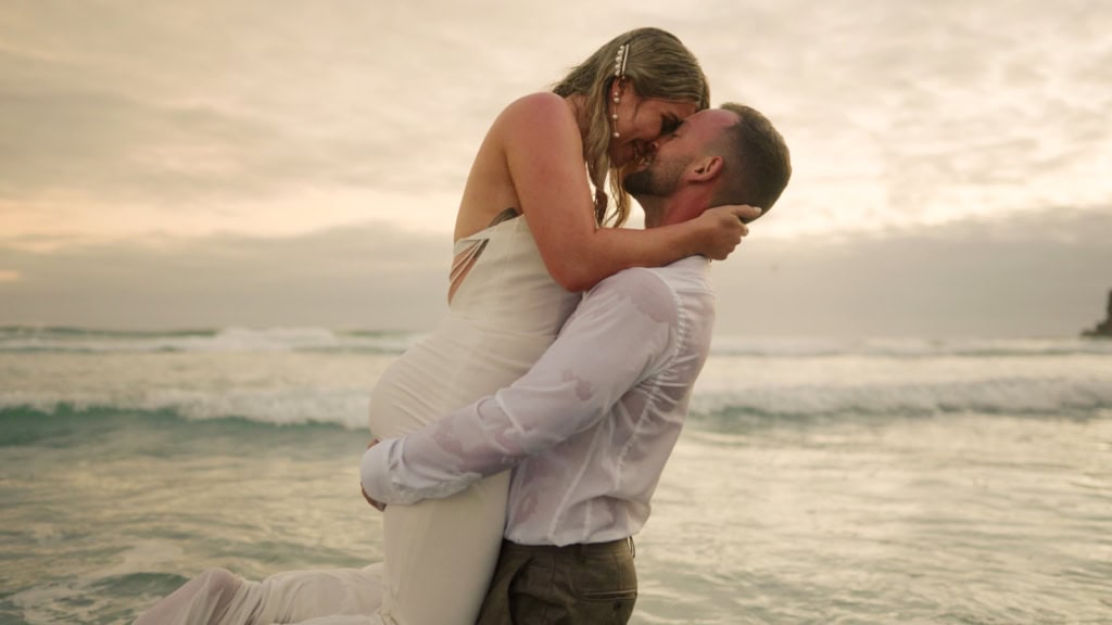 Bride and groom drown the dress in the sea ocean